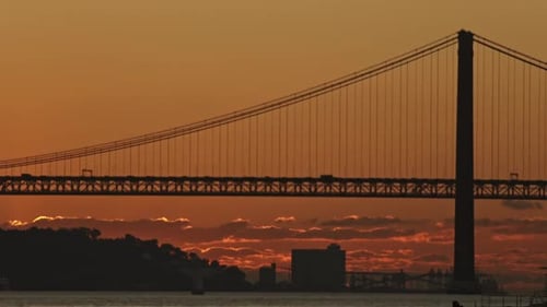 A Majestic Bridge Stretching Across a Serene Body of Water
