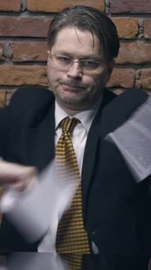 Businessman Tearing a Contract in Pieces