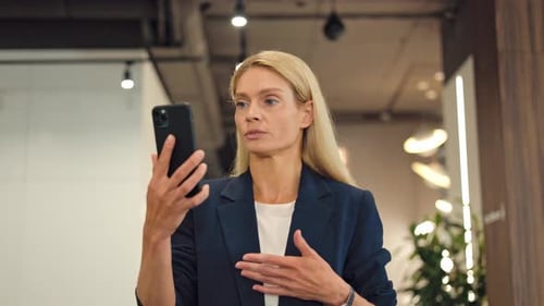 Woman on Video Call in Modern Office
