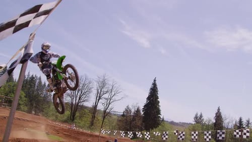Dirt Bike Riders Jumping on Outdoor Motocross Track