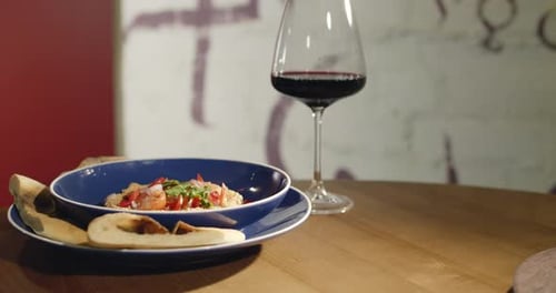 Bowl of Prepared Food with Red Wine