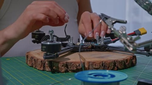 Details Woman Repairs Quadcopter