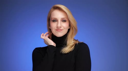 Blond Woman Posing in Black Turtleneck