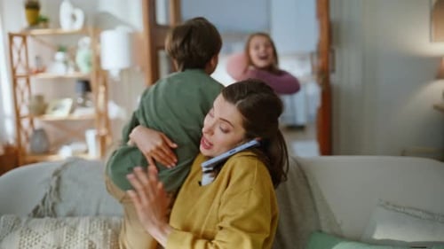 Mother Businesswoman Working Home Calming Down Hyperactive Children Closeup