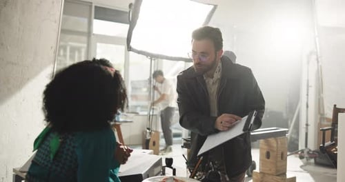 Studio Film Crew Reviews Documents Indoors
