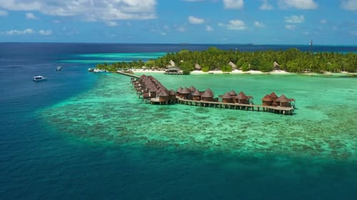Tropical Island with Villas Coconut Palm Trees Blue Lagoon White Sandy Beach at Bora Bora Island
