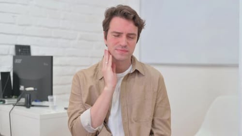 Portrait of Young Creative Man with Toothache