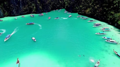 Aerial view of iconic tropical turquoise water Pileh Lagoon surrounded by limestone cliffs, Phi Phi
