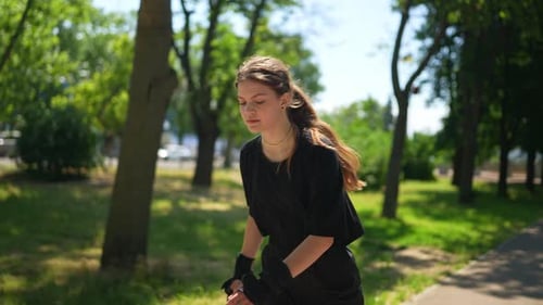 Woman Roller Skating in the Park