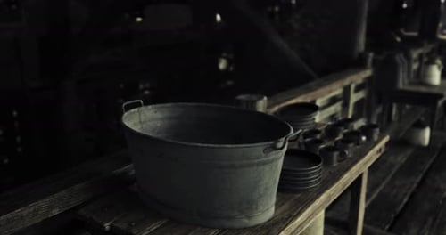 Slow Zoom on Rustic Metal Wash Tub and Dishes
