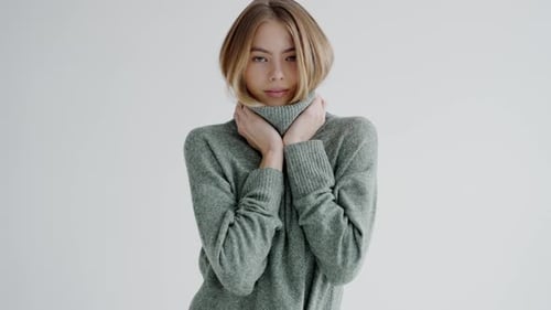 Young Woman Posing in Green Sweater