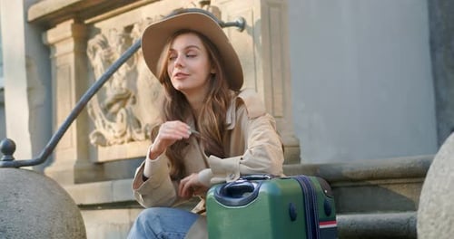 Cute Woman Walking While City Buildings Look Around Feel Happy Smile at Sunlight