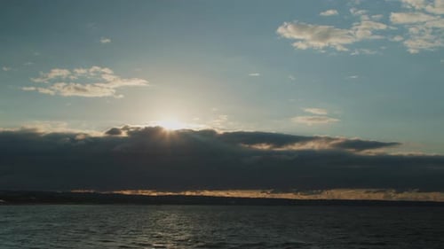 Dramatic Sunset Over the Ocean with Golden Light
