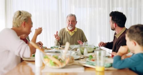 Family meal around wooden table during daytime