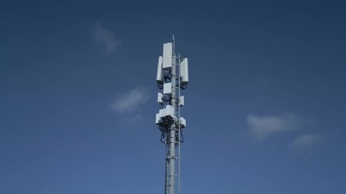 The Telecommunication Cell Tower Stands Tall Under a Clear Blue Sky Facilitating Communication