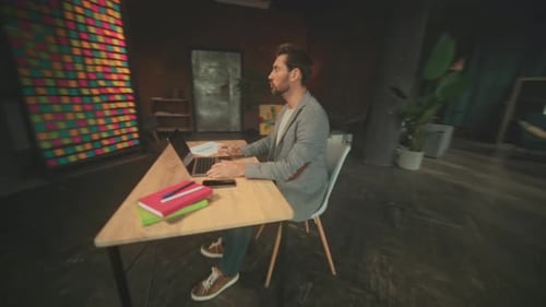 Man Working Indoors Individual Engaged in Creative Work Person Working in Bright Studio with Tools