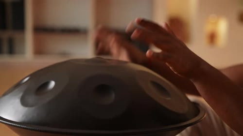 Closeup Hands of Unrecognizable African Man Playing Traditional Ethnic Music Using Glucophone