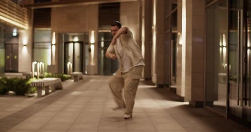 Energetic Freestyle Dancer Performing on Street