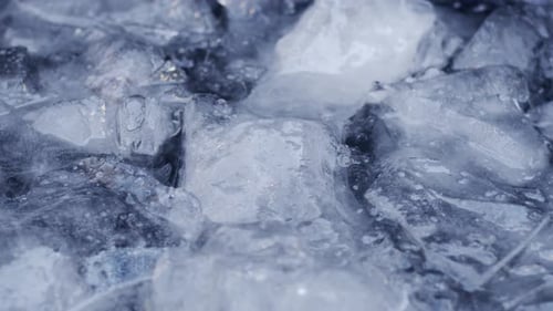 Cold ice water moving in a lake with ice chunks floating