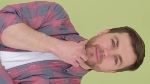 Portrait of an American Pensive Man Isolated on Background in Studio Vertical Video