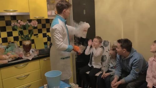 Excited Children Watch Chemistry Experiment with Dry Ice