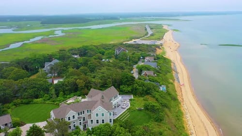 Aerial View of Beachfront Houses and Coastline