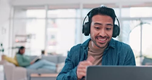Man Talking on Laptop During Video Conference