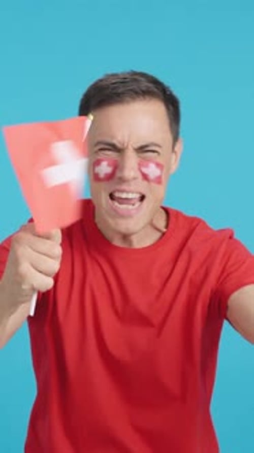Man Cheering with Flag and Face Paint