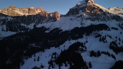 Glarus Switzerland winter alpine landscape Fronalpstock mountain summit aerial drone view