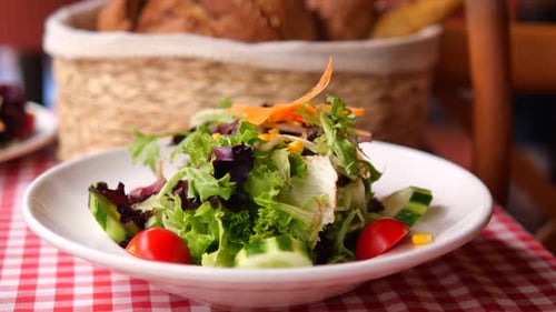 Fresh Salad Served in a Cozy Restaurant Setting
