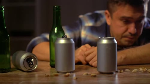 Alcoholism, Alcohol Addiction And People Concept - Male Alcoholic Drinking Beer From Bottles And ...