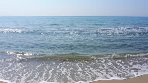 Sandy Beach with Sea Waves