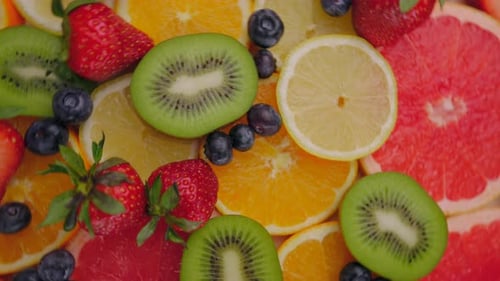 Background of Fresh Fruits and Berries Rotating Vegan Sweet Food Flat Lay