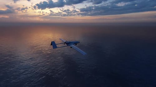 Unmanned Drone Flying Above Ocean at Sunset