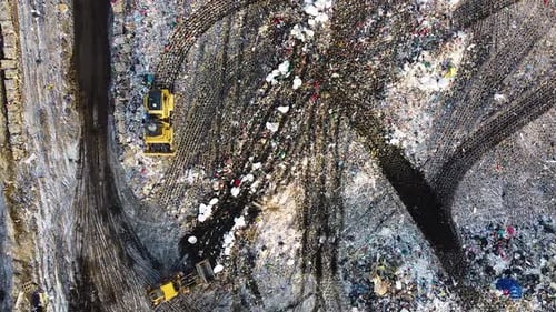 Aerial flyover landfill full of trash, pollution environmental problem, garbage, trucks dump waste p