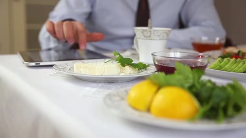 Business Man is Having Breakfast