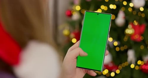 Smartphone with Green Screen in Festive Setting