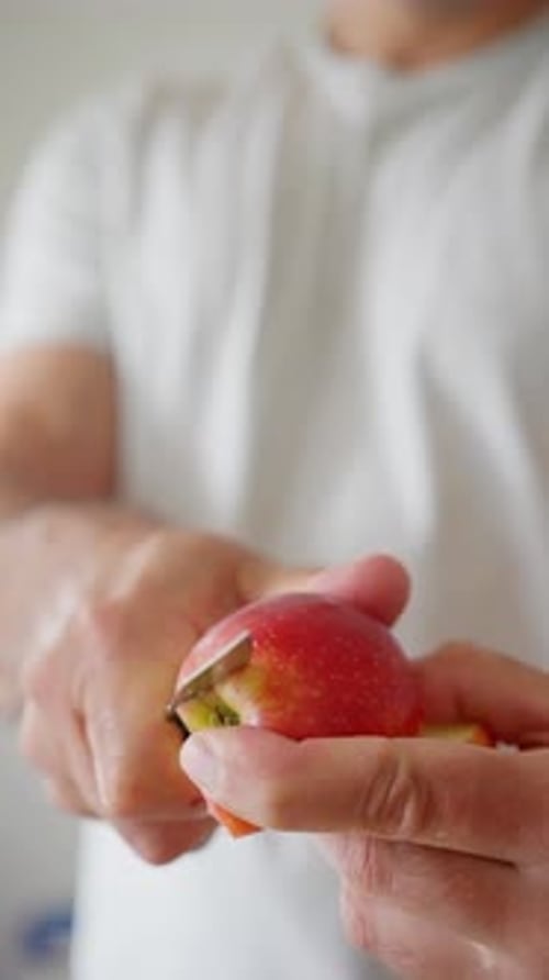 Cutting an Apple with Careful Precision is a Skill That Combines Both Art and Technique
