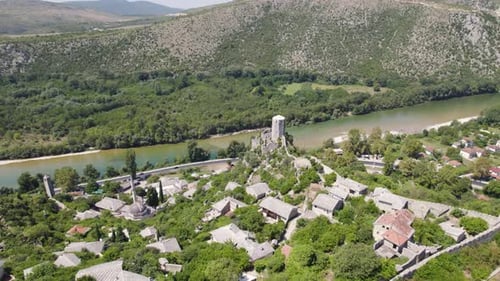 Aerial orbit medieval city Pocitelj, castle and minaret, Bosnia and Herzegovina