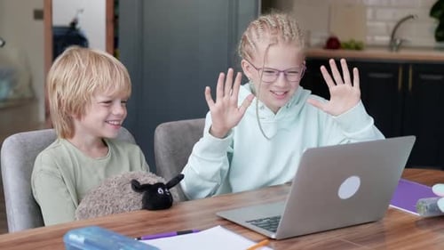 Online School Class Siblings Pupils Boy and Girl Learning Together Remotely Online at Home Looking