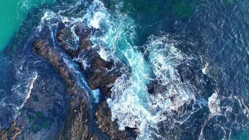 Water Surface Seaside Rocks and Foam Ocean Movement Top View Turquoise Coastline Pattern Tropical