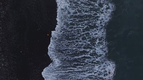 Aerial view of black sand beach at sunrise, Portugal.