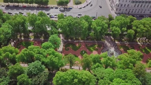 Summer Garden, an aerial drone fly by of a beautiful Koronniy (Crowning) fountain from top, people v