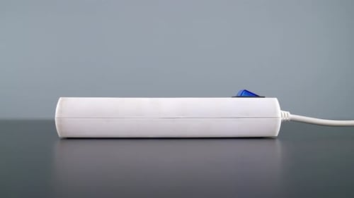 Finger Toggling Switch Off on Extension Cord