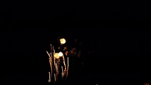 fireworks and streamers illuminate the night sky