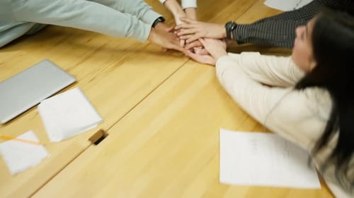 Cheerful Colleagues Celebrate Success in Office Setting