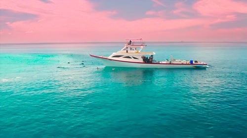 Fishermen on a White Boat Sunset Time in Local Island Ukulhas in the Maldives