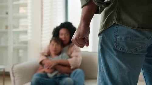 Clenched Fist Threatening Mother and Child at Home