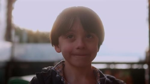 Portrait of happy young boy smiling at camera