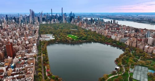 Gorgeous scenery of Central Park in New York. Amazing green zone surrounded by dense architecture